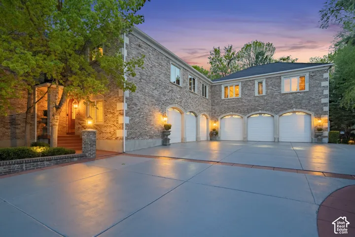 View of front of house featuring driveway and an attached garage