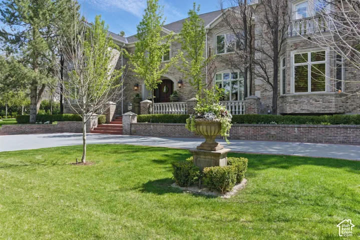 View of property's community featuring a lawn