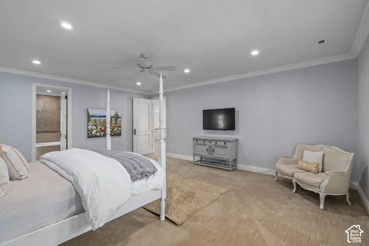 Bedroom featuring carpet flooring, recessed lighting, ornamental molding, a ceiling fan, and ensuite bathroom