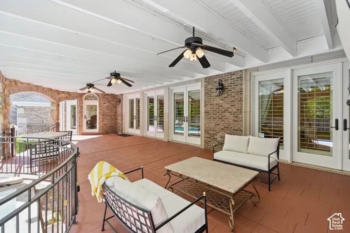 Deck featuring french doors, a patio, an outdoor hangout area, and ceiling fan