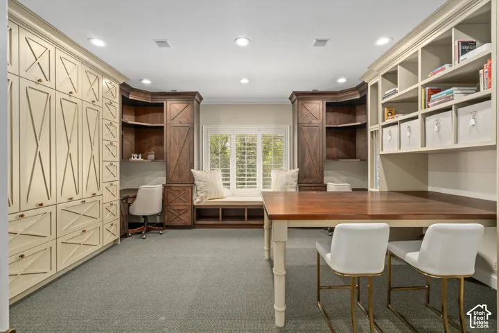 Office featuring built in study area, light carpet, crown molding, and recessed lighting