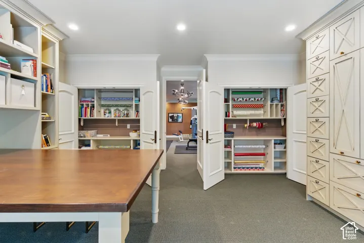 Home office with ornamental molding, dark colored carpet, and recessed lighting