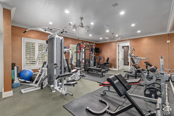 Exercise room with recessed lighting and crown molding