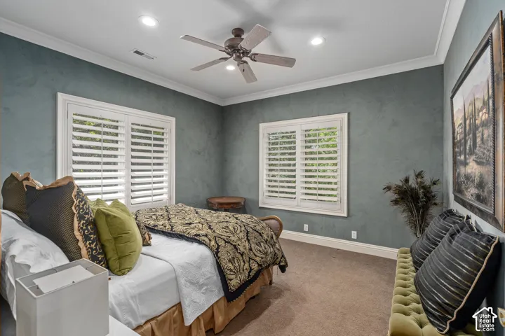 Bedroom with crown molding, carpet, a ceiling fan, and recessed lighting