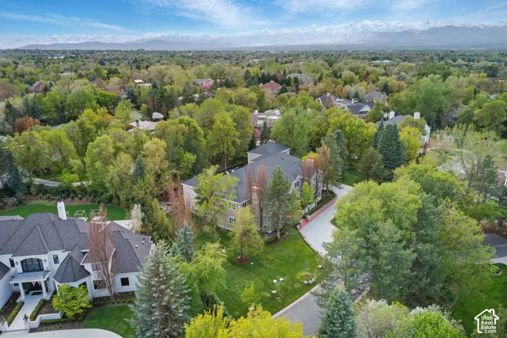 Aerial view of residential area featuring mountains