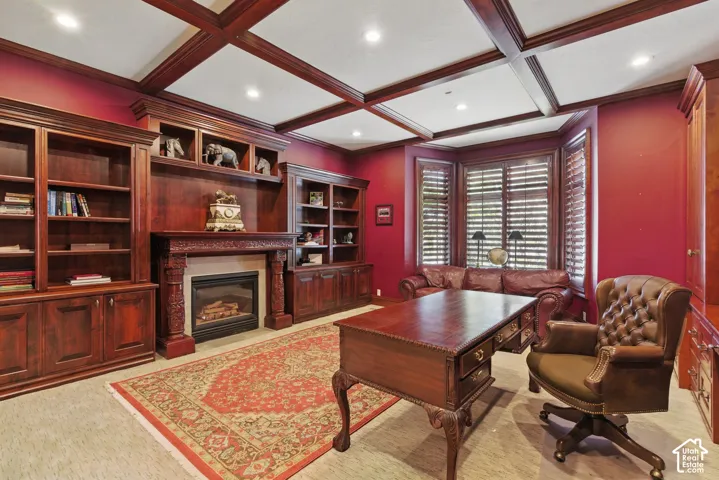 Office with a premium fireplace, beamed ceiling, coffered ceiling, and recessed lighting