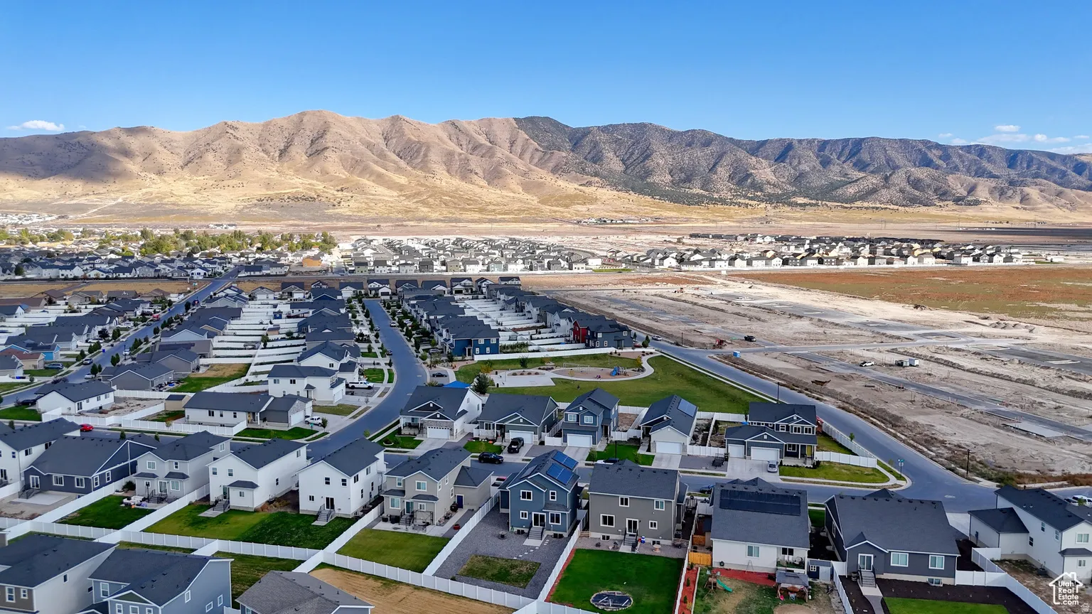Aerial view of residential area with a mountain backdrop
