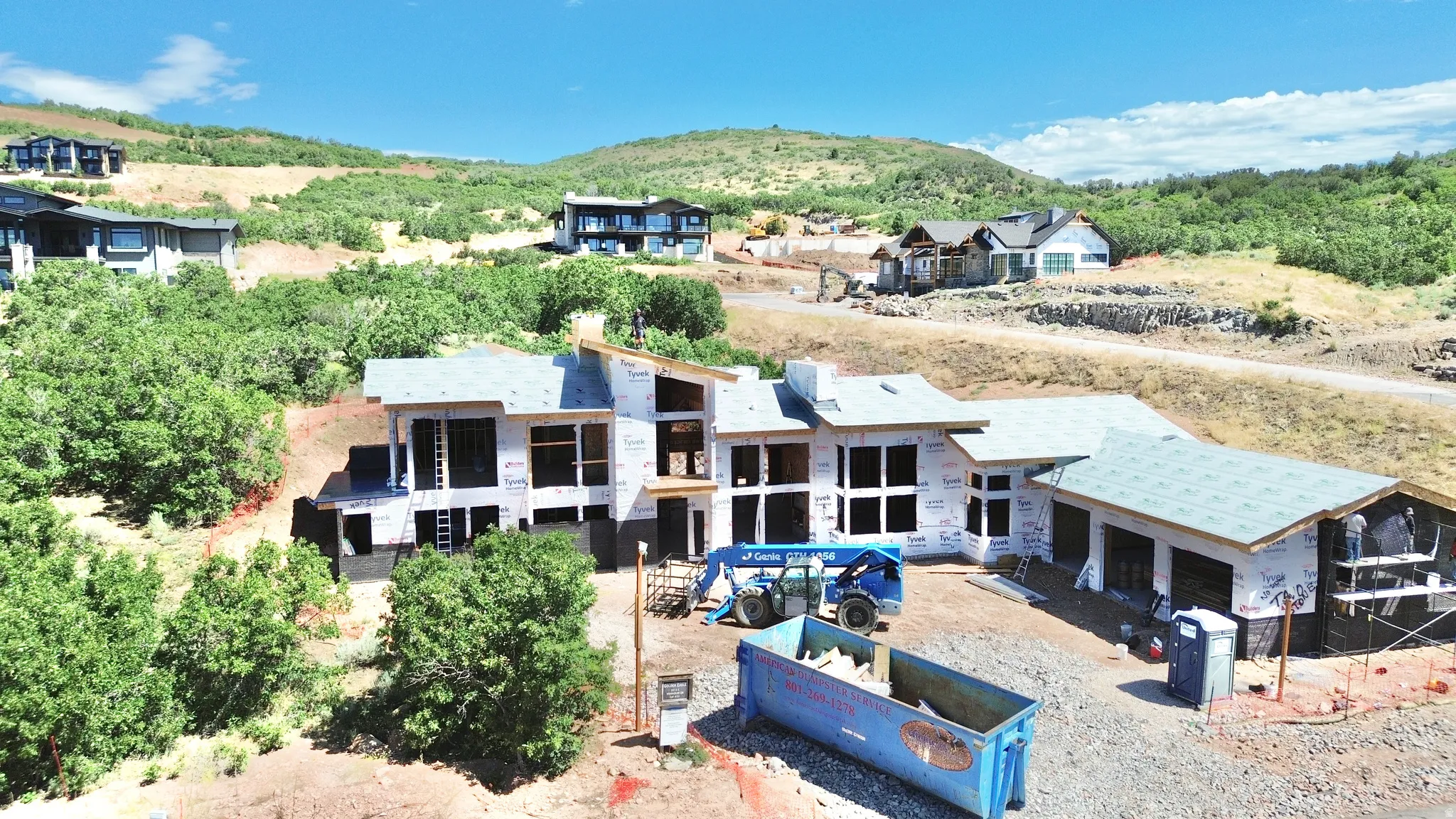 Expansive property site with a multi-level structure under construction
