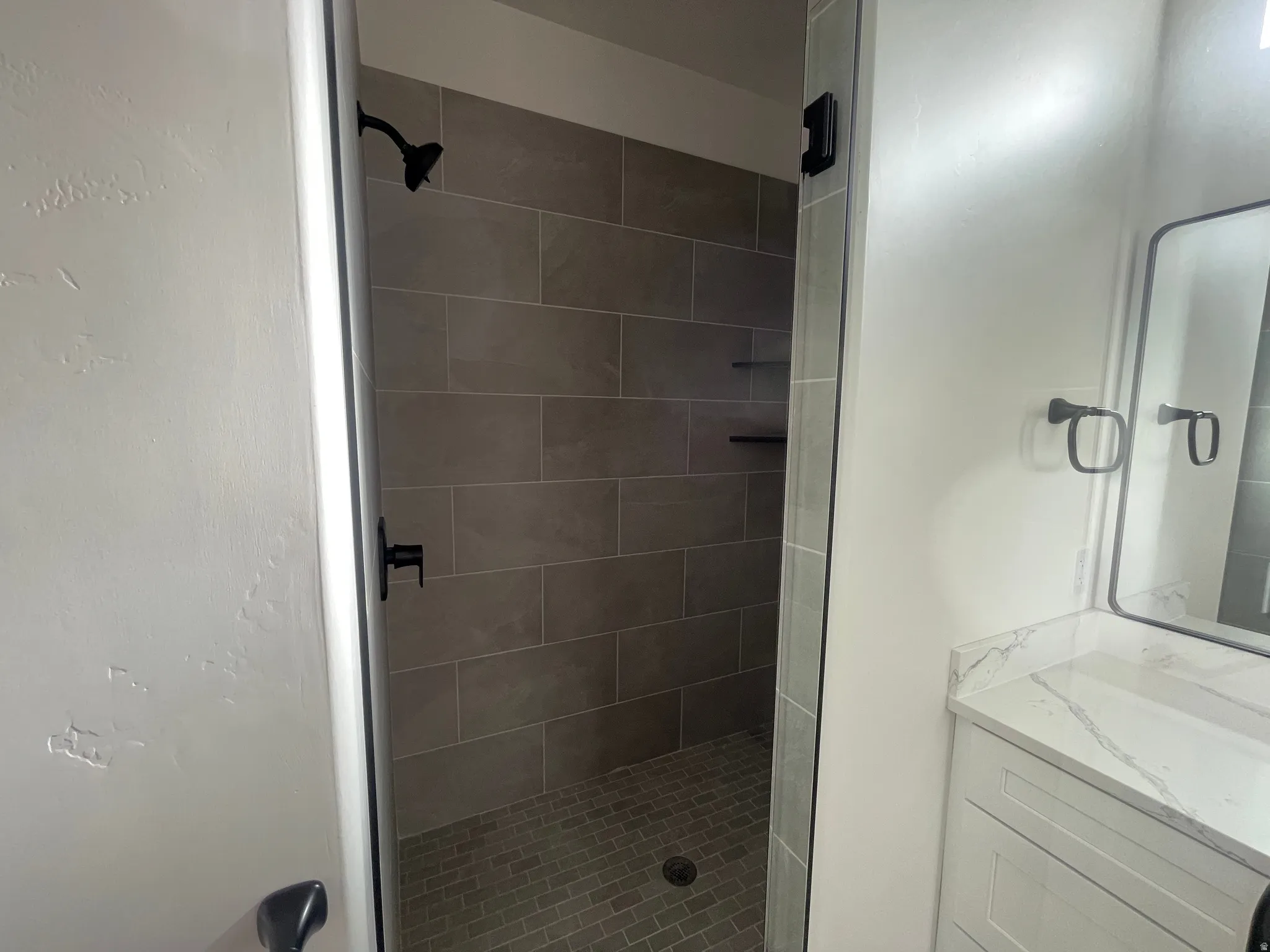 Full bathroom featuring vanity and a stall shower