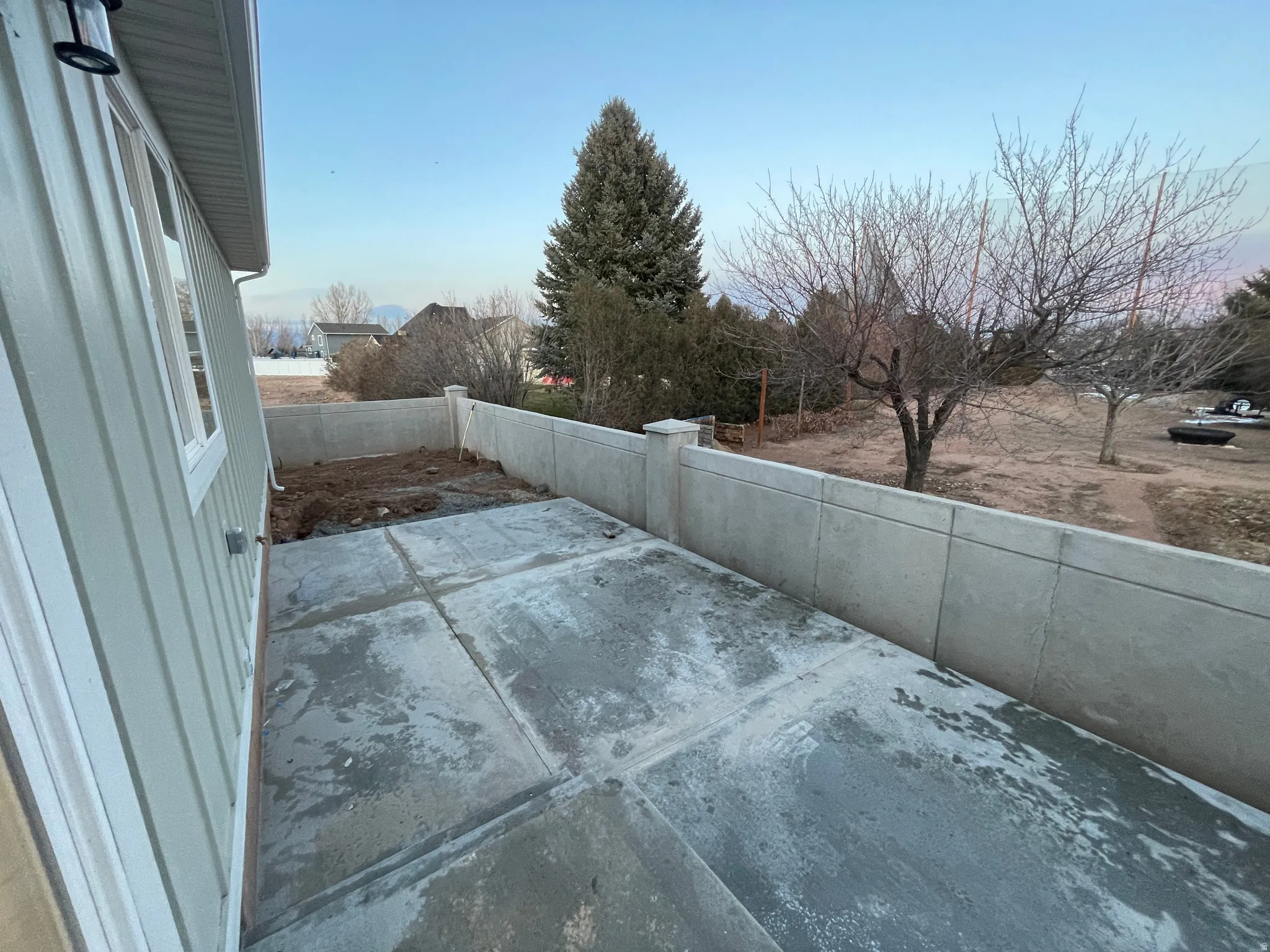 Fenced backyard featuring a patio