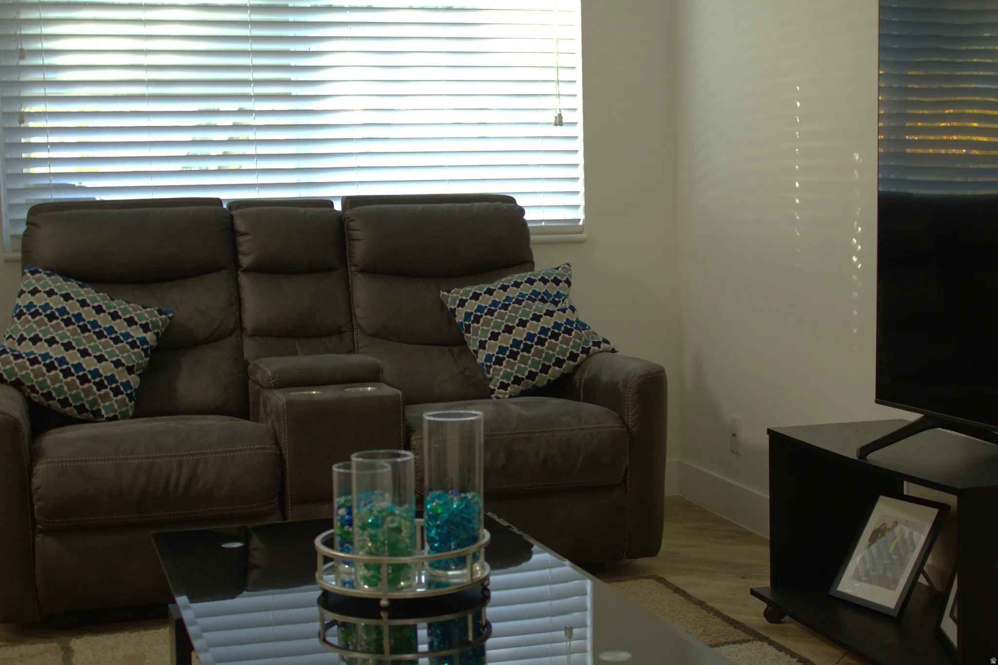 Living room with wood finished floors and baseboards