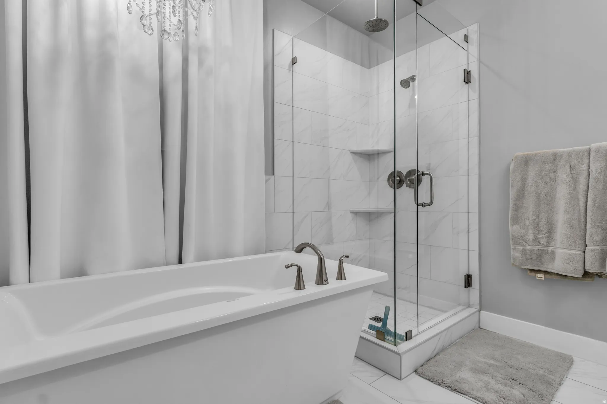 Bathroom featuring a soaking tub and a stall shower