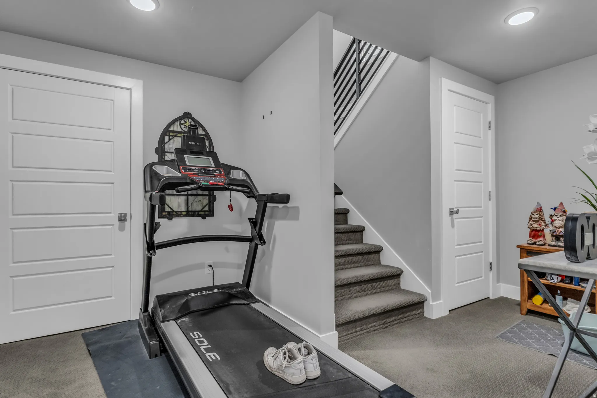 Workout room featuring carpet floors and recessed lighting