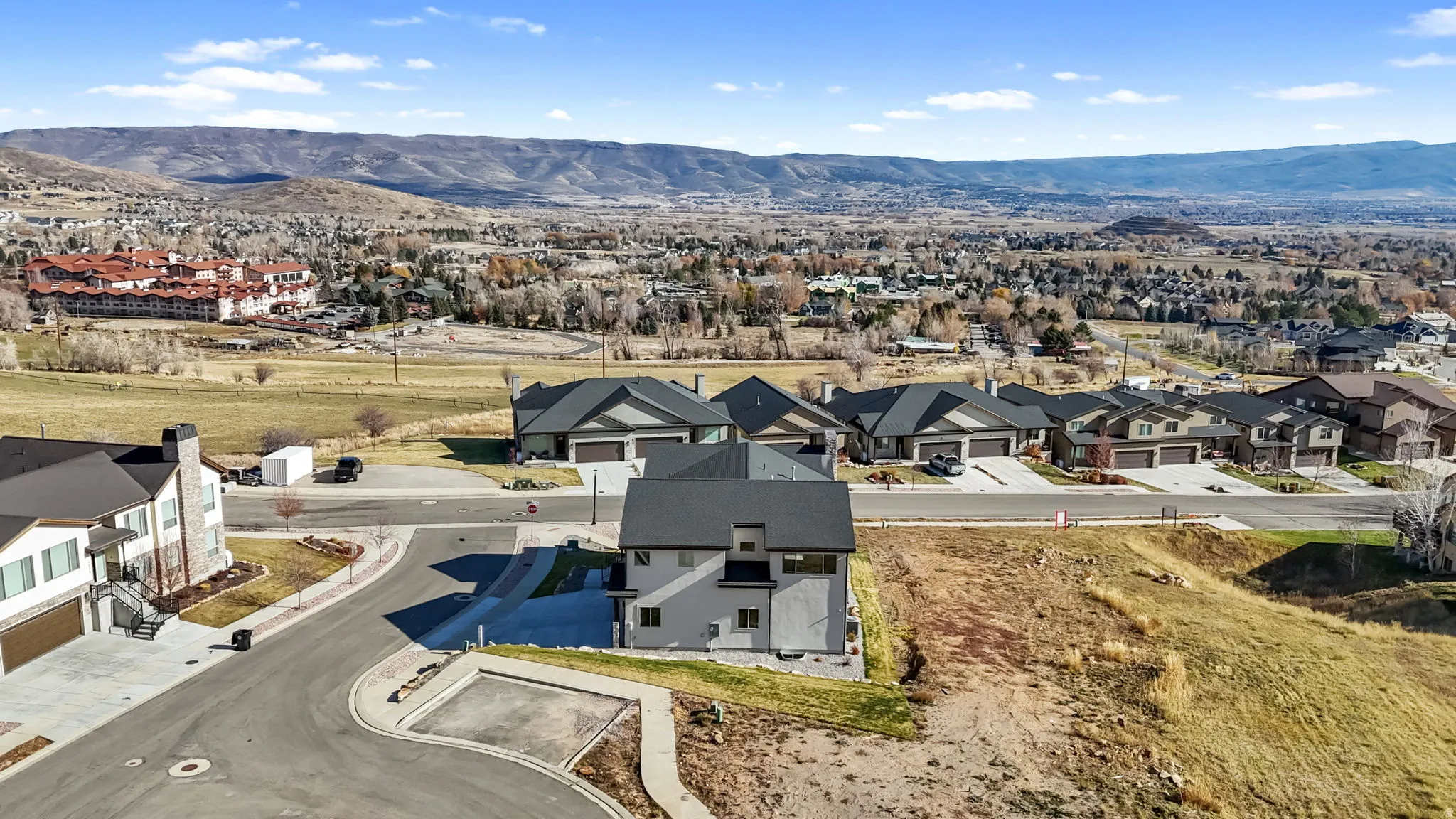 Aerial view of residential area with a mountain backdrop