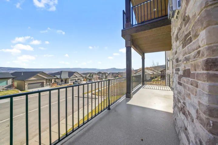 Balcony with a residential view and a mountain view