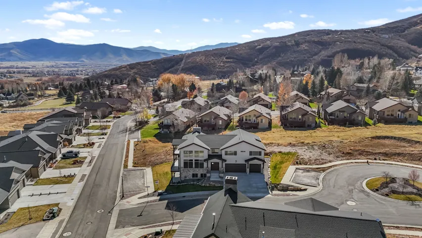 Aerial view of residential area with a mountainous background
