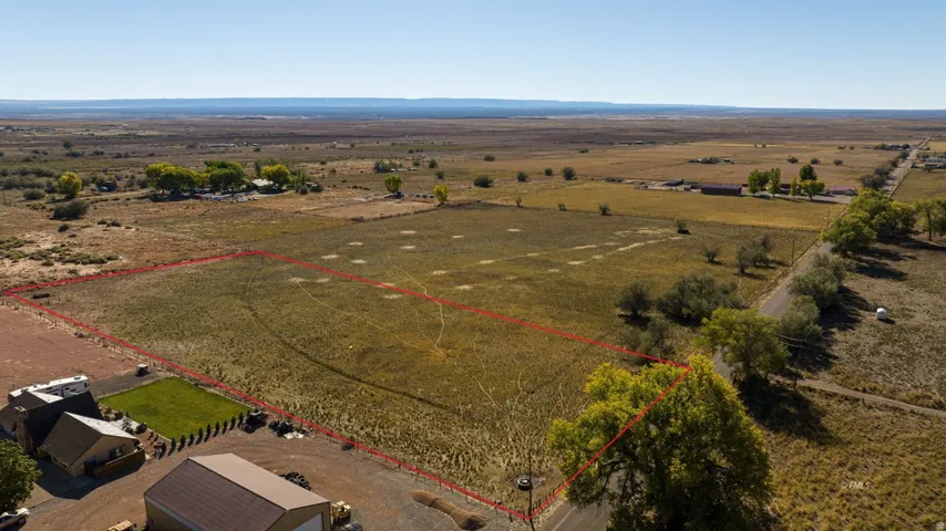 Aerial view of sparsely populated area with property boundaries highlighted