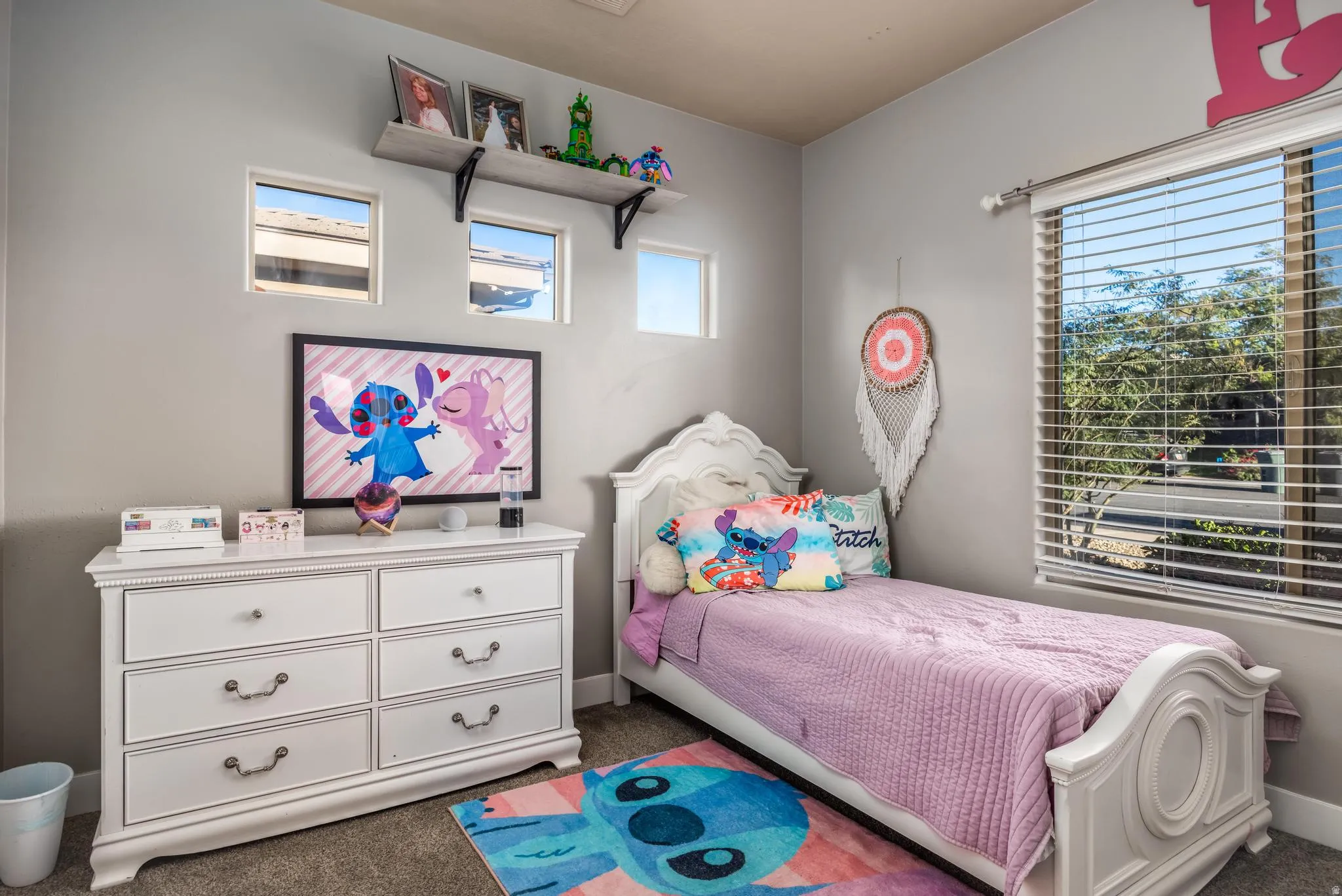 Carpeted bedroom with baseboards