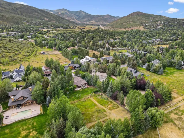 Aerial perspective of suburban area featuring a mountainous background