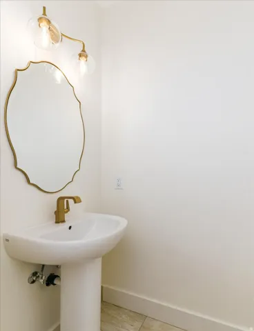 Bathroom featuring baseboards