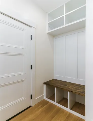 Mudroom with light wood-style flooring