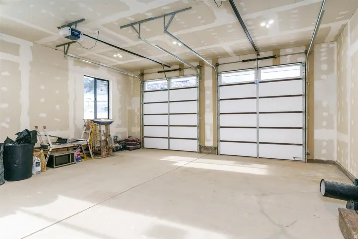 Garage featuring a garage door opener