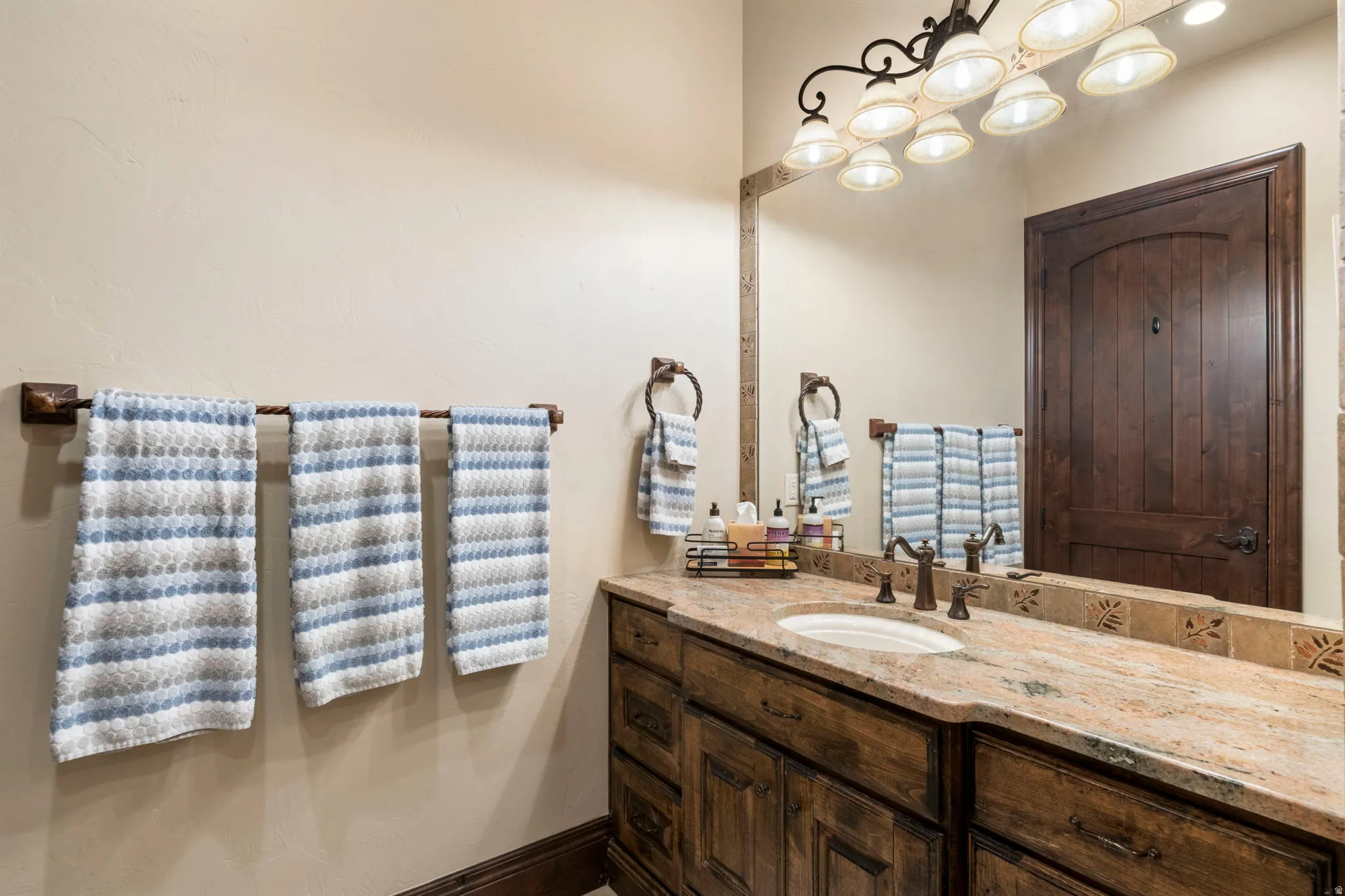 Bathroom featuring vanity and baseboards