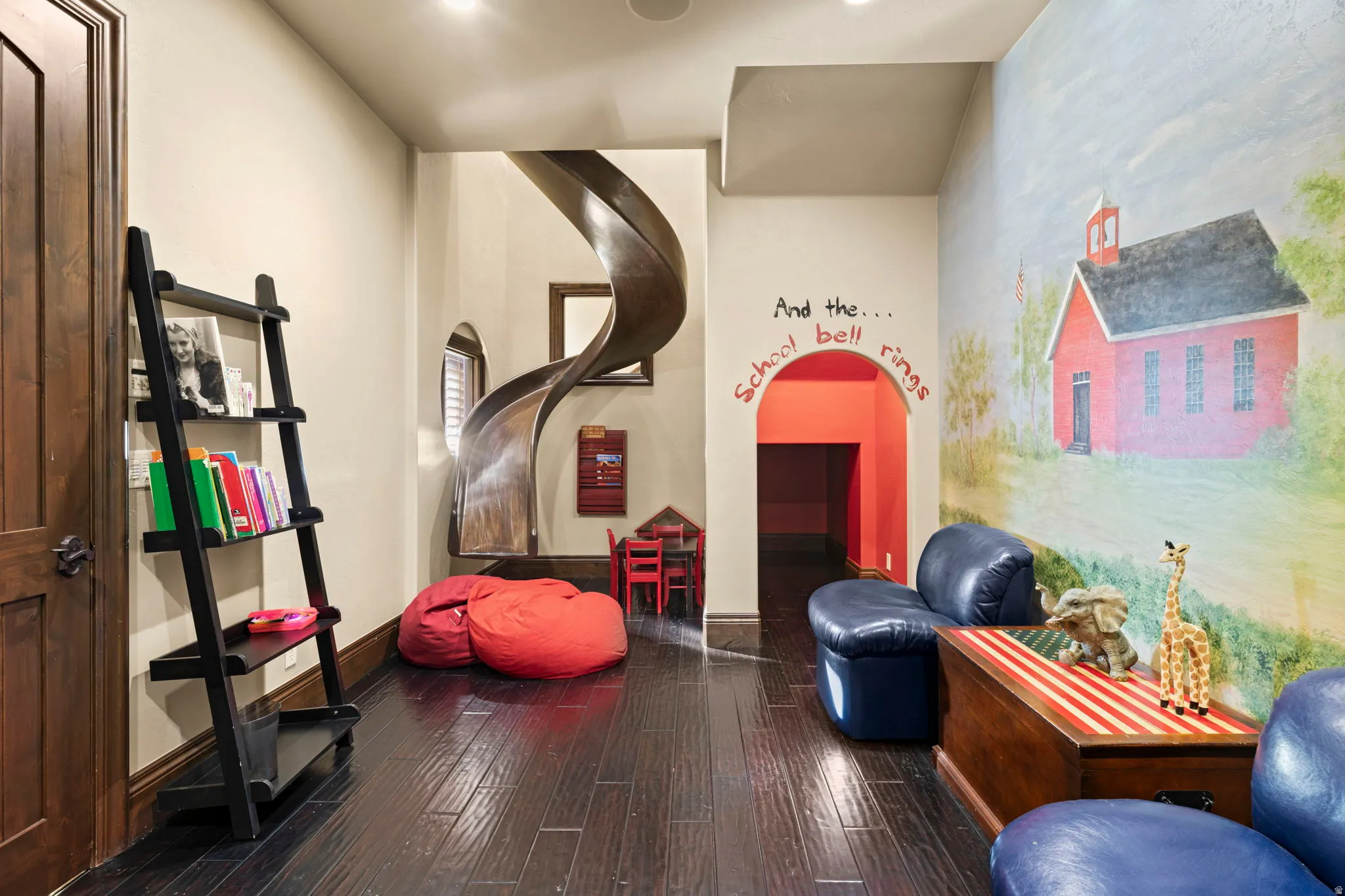 Workout room with dark wood finished floors and baseboards