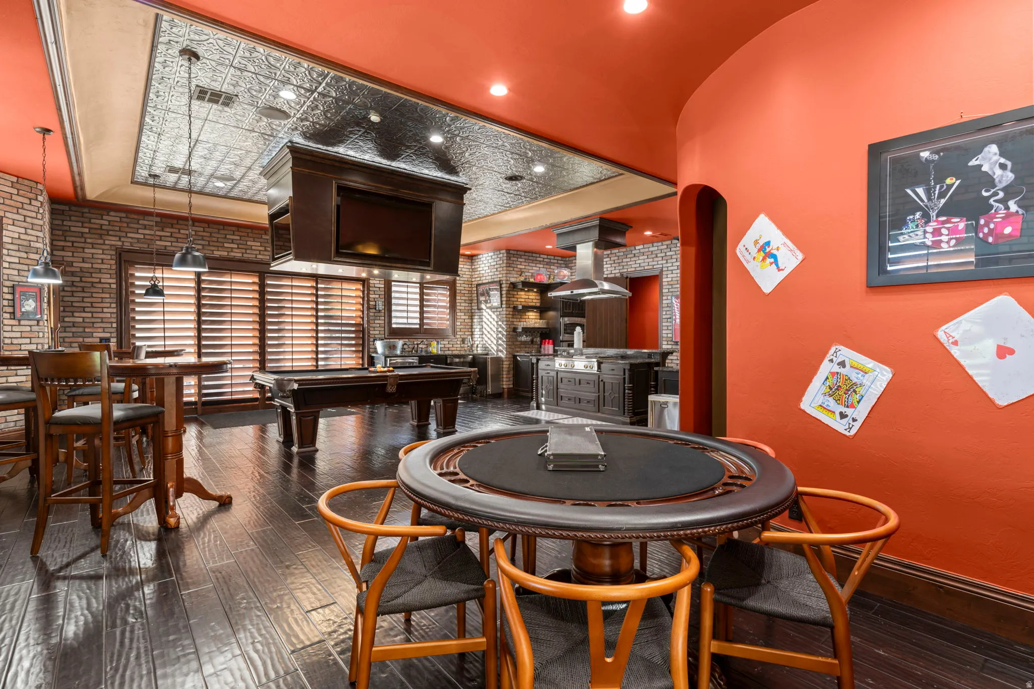 Playroom with billiards table, brick wall, and arched walkways