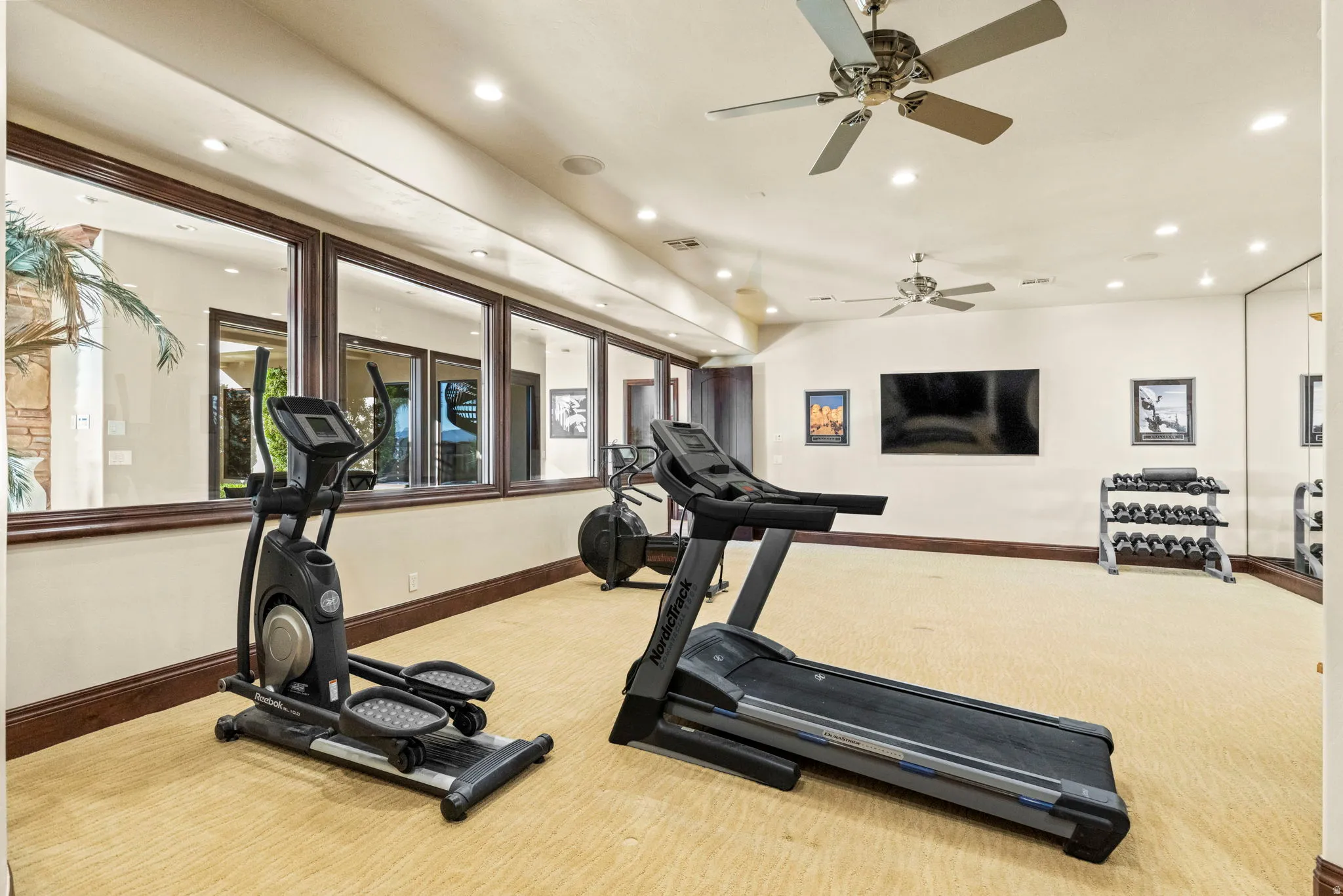 Exercise room featuring recessed lighting and ceiling fan