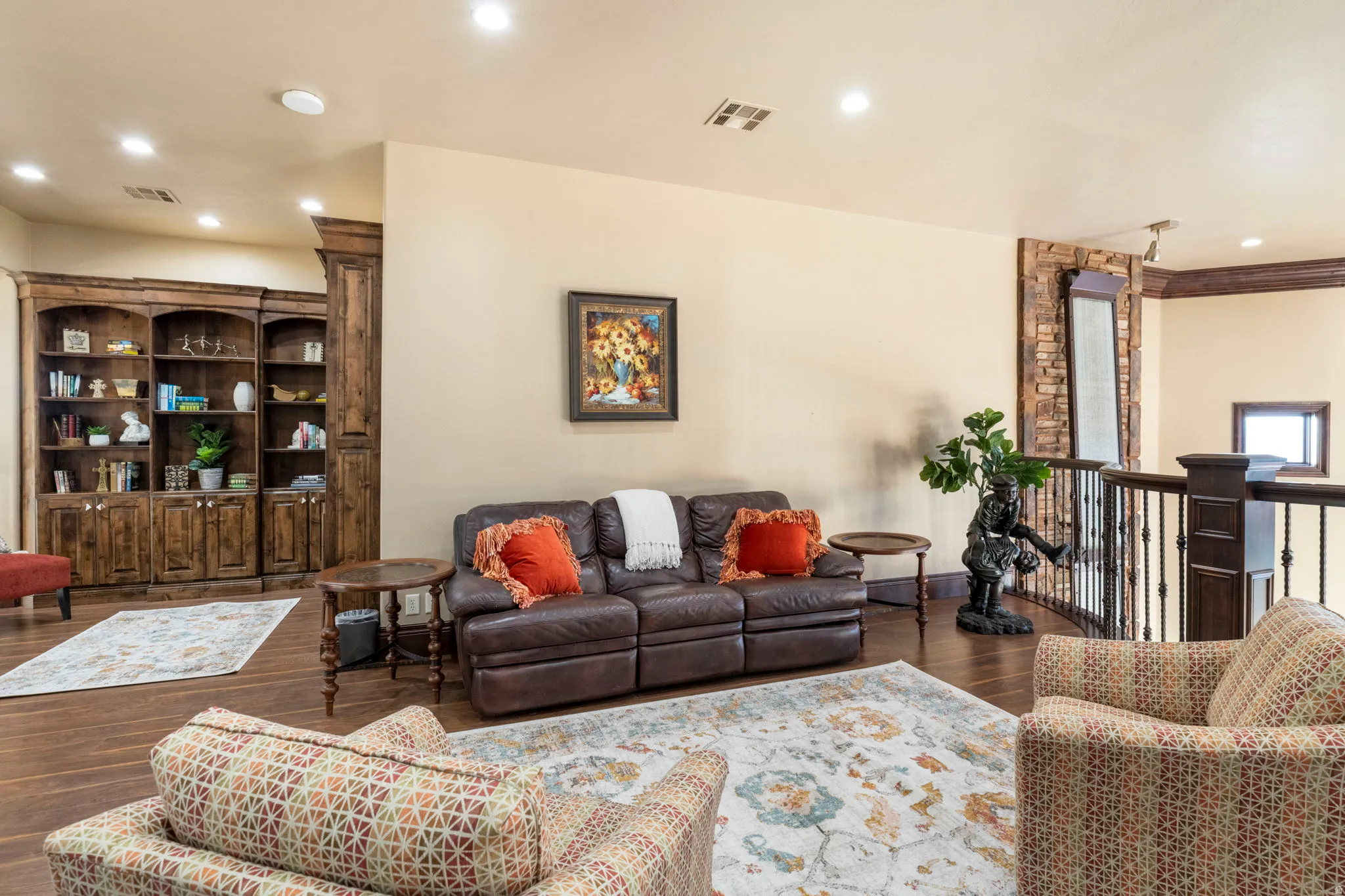 Living room with recessed lighting and dark wood-style floors