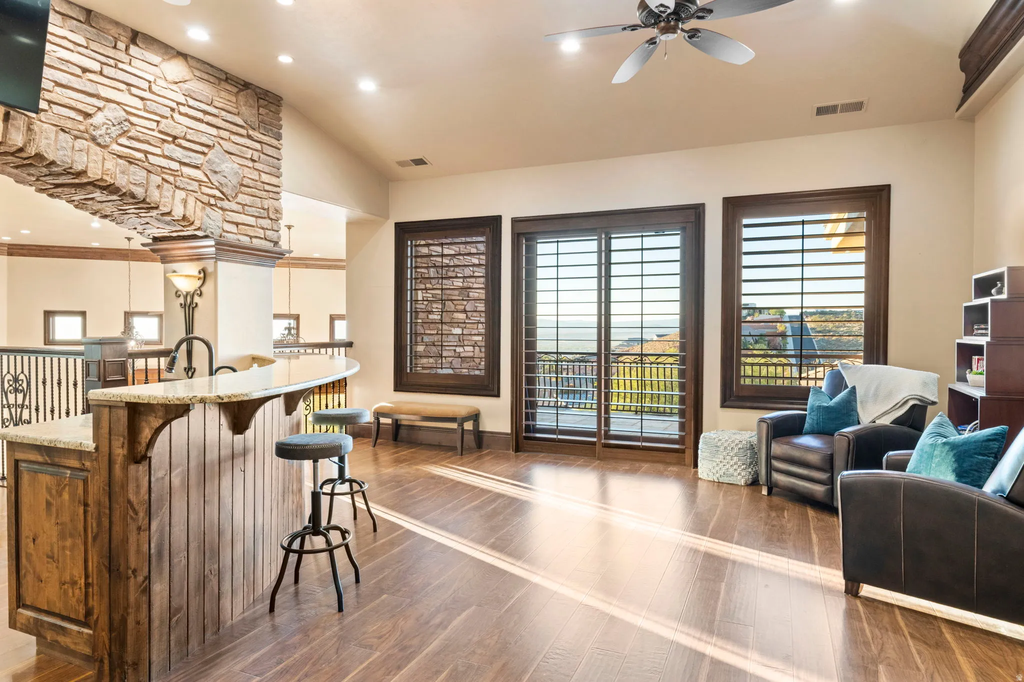 Kitchen featuring dark wood finished floors, plenty of natural light, recessed lighting, a breakfast bar, and vaulted ceiling
