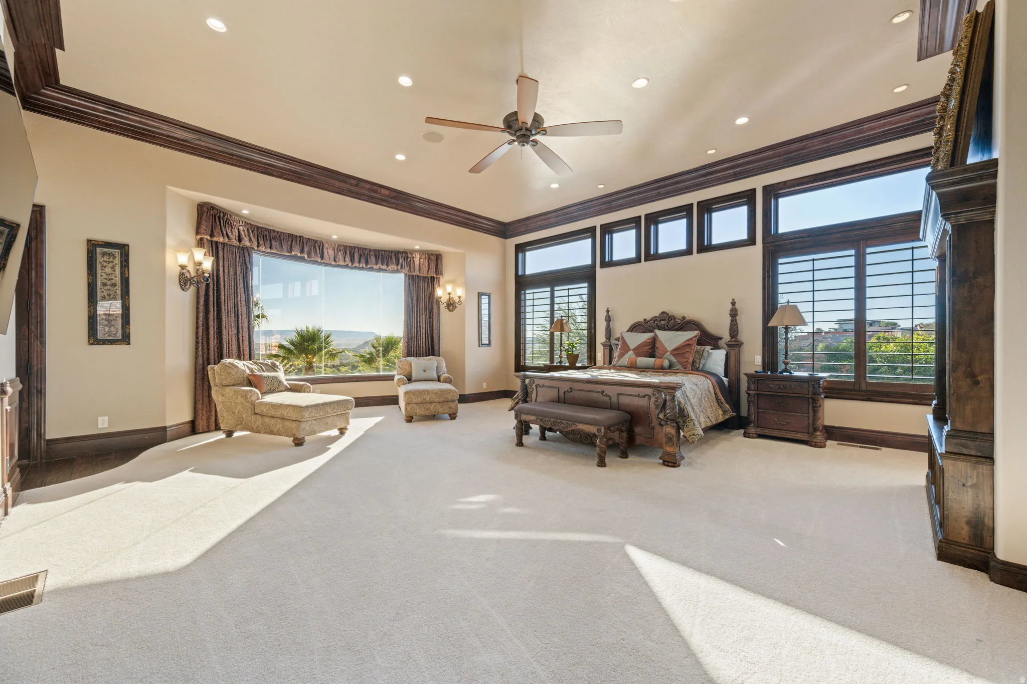 Carpeted bedroom featuring crown molding, recessed lighting, and a ceiling fan