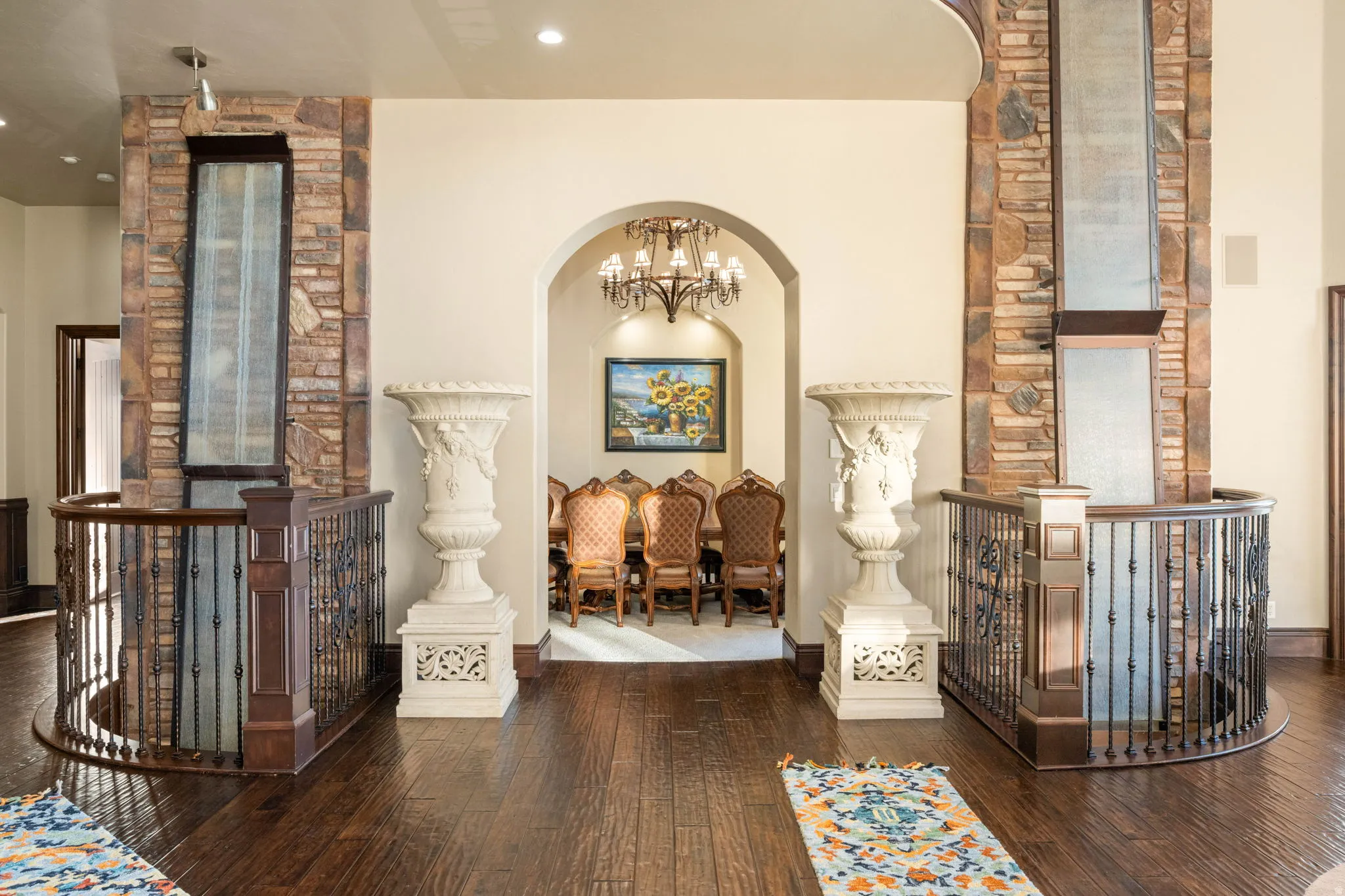 Hallway featuring a chandelier, an upstairs landing, and hardwood / wood-style flooring