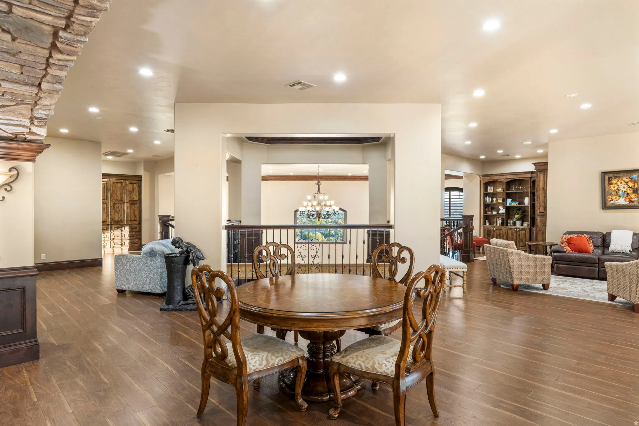 Dining area featuring recessed lighting, dark wood-type flooring, and a chandelier