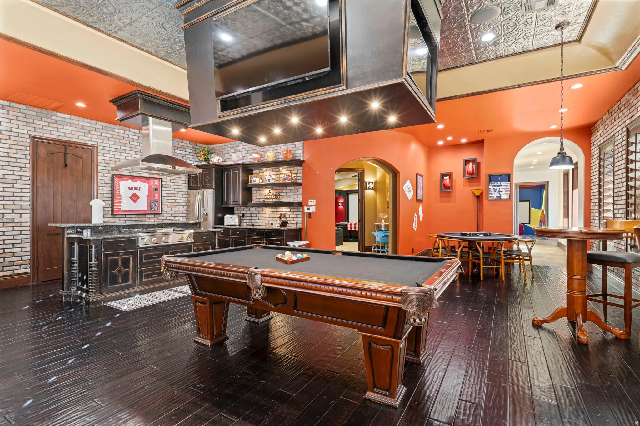 Recreation room featuring brick wall, billiards, arched walkways, an ornate ceiling, and recessed lighting