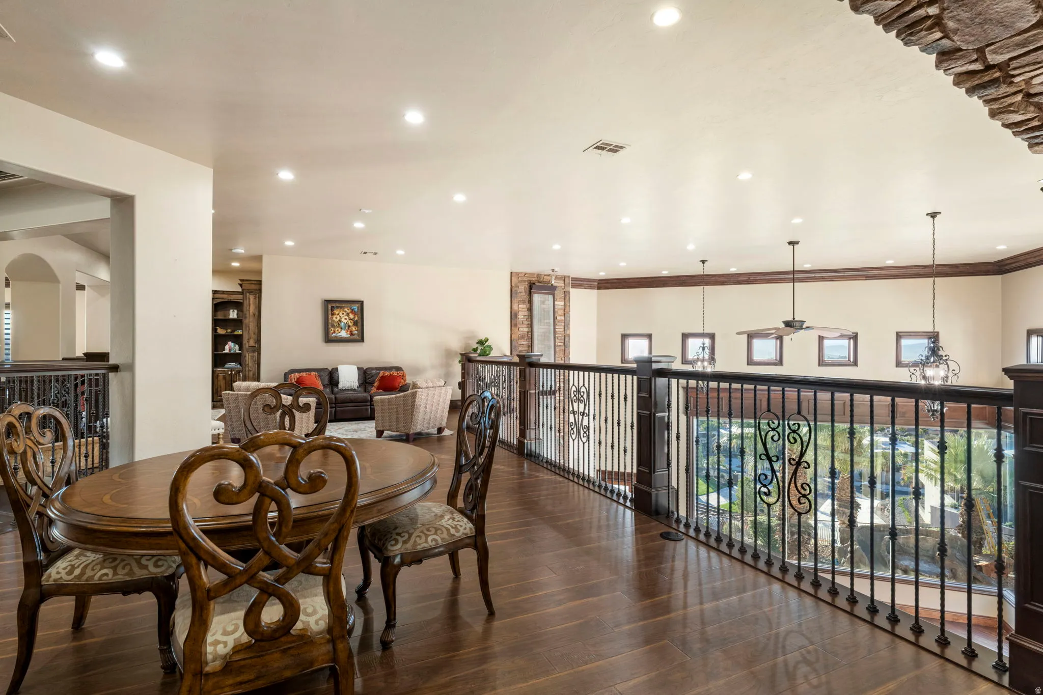 Dining area with dark wood-type flooring, recessed lighting, and ceiling fan