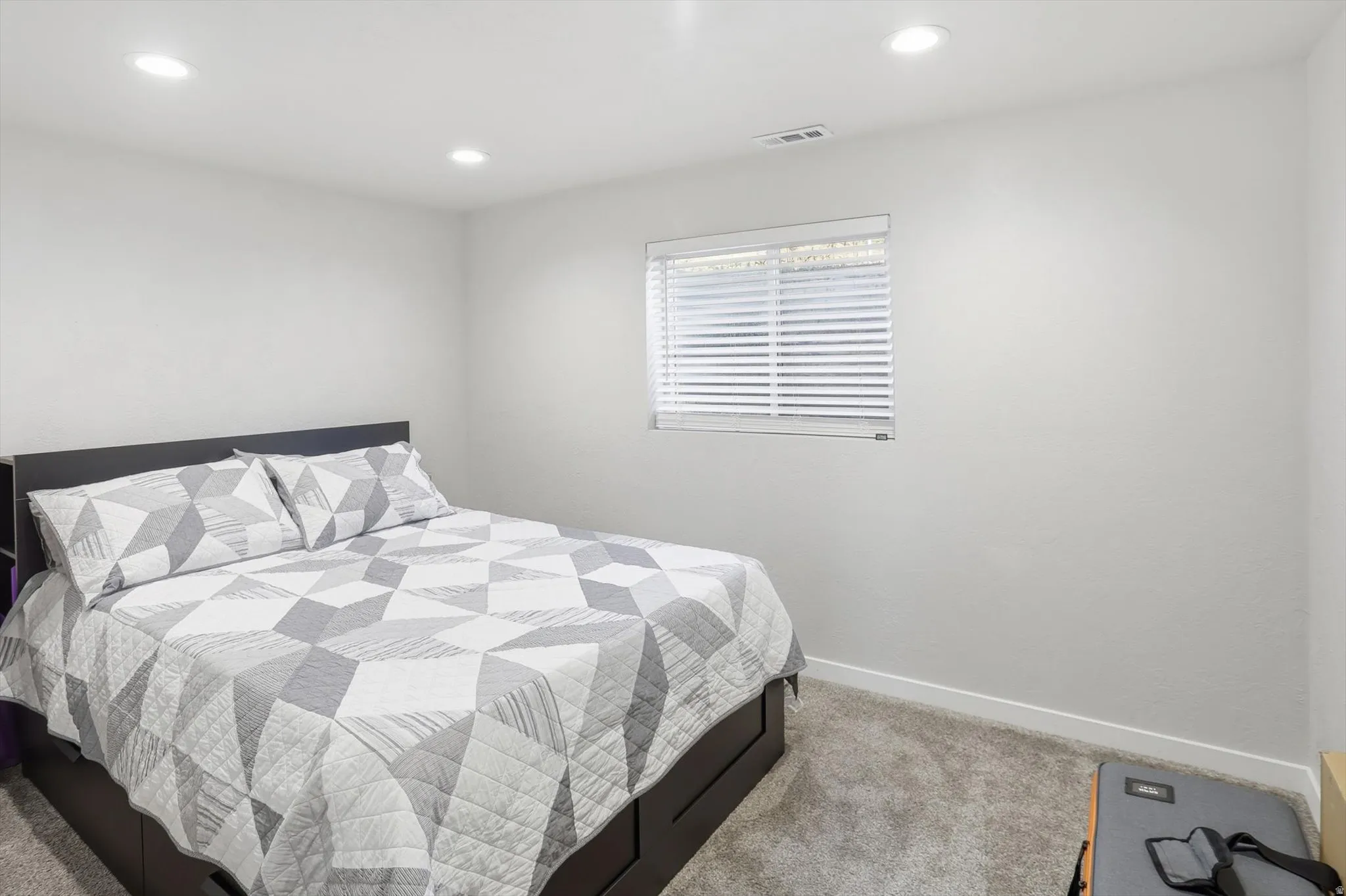 Bedroom featuring carpet and recessed lighting