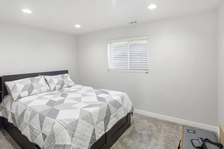 Bedroom featuring carpet and recessed lighting