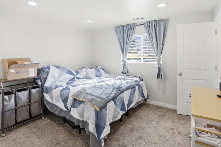 Bedroom featuring recessed lighting and light colored carpet