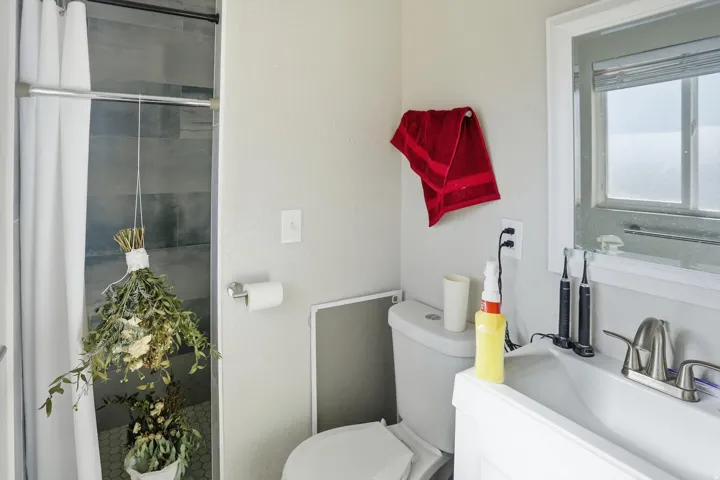 Full bathroom featuring toilet and vanity