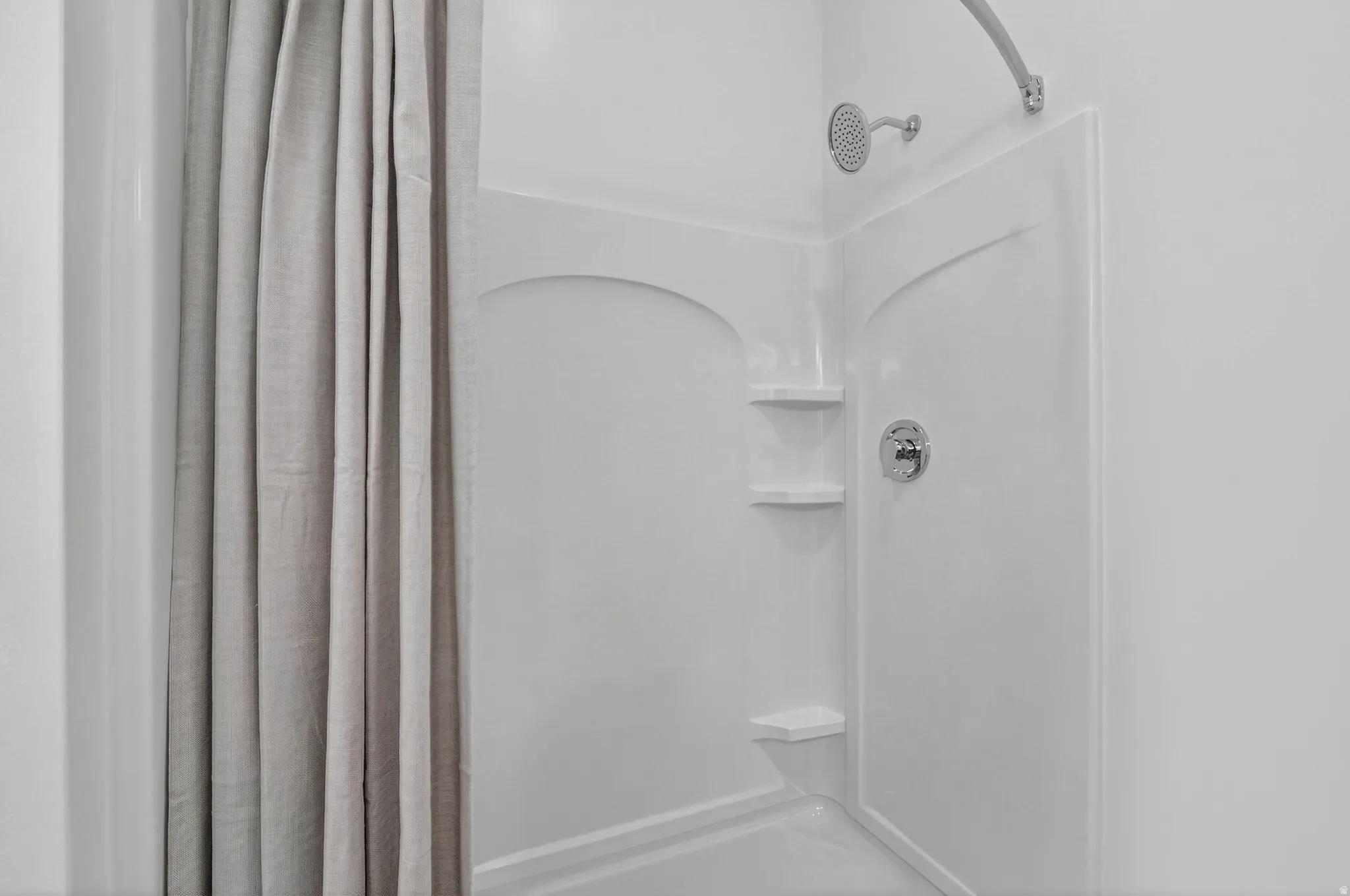 Primary bathroom with double vanity and walk in shower.