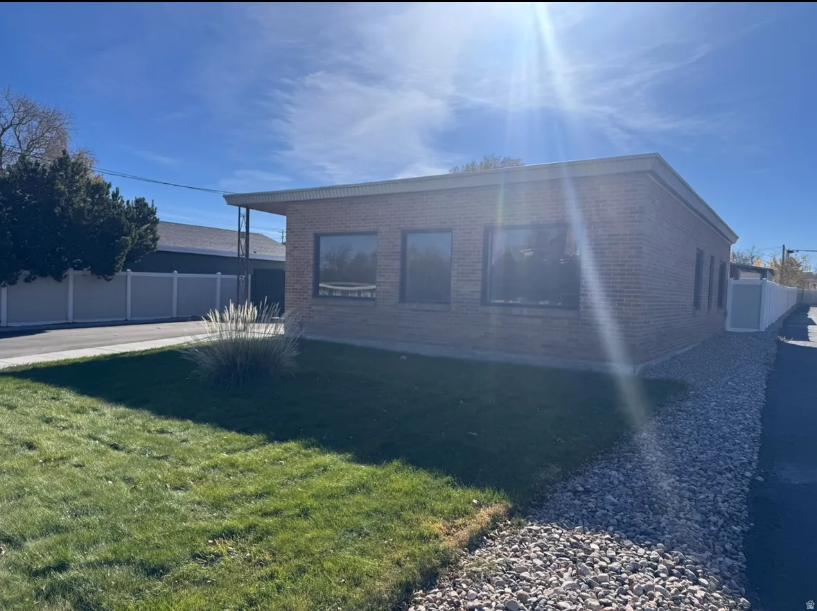 View of property exterior featuring brick siding