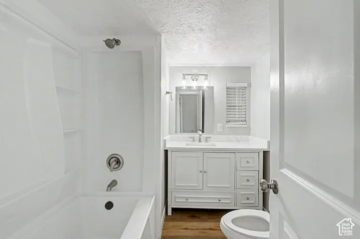 White shaker-style vanity with a light-colored countertop