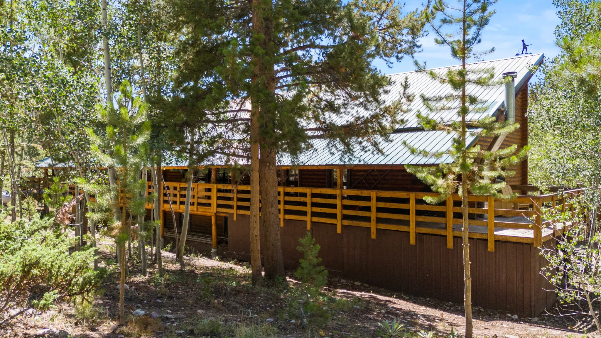 Back of house with a metal roof