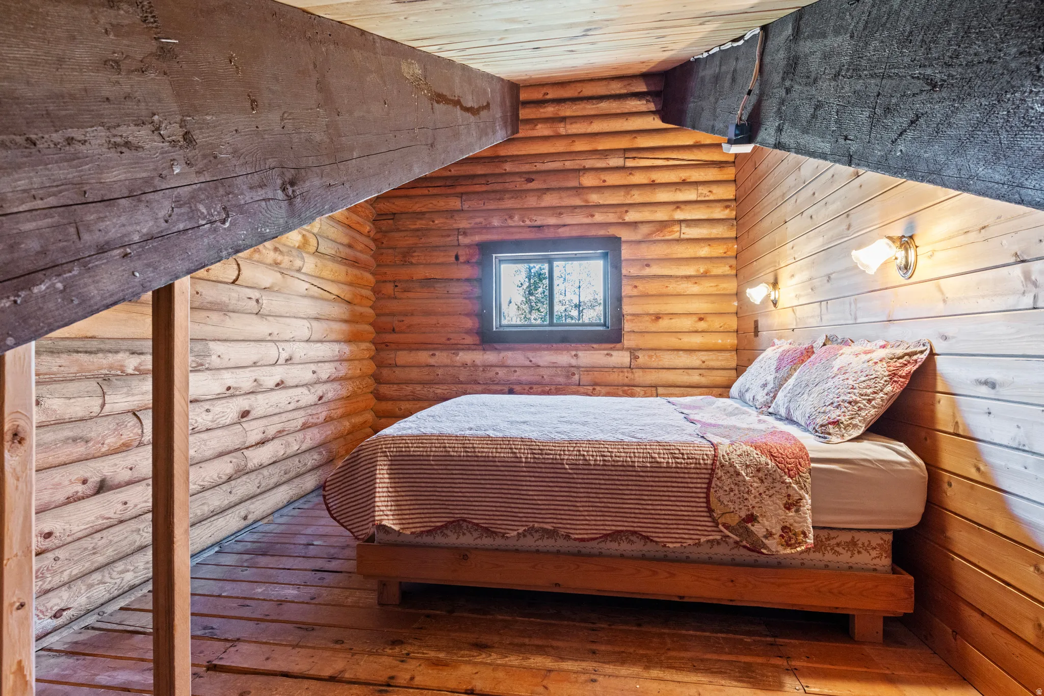 Bedroom featuring rustic walls, a sauna / steam room, wood-type flooring, wooden ceiling, and vaulted ceiling