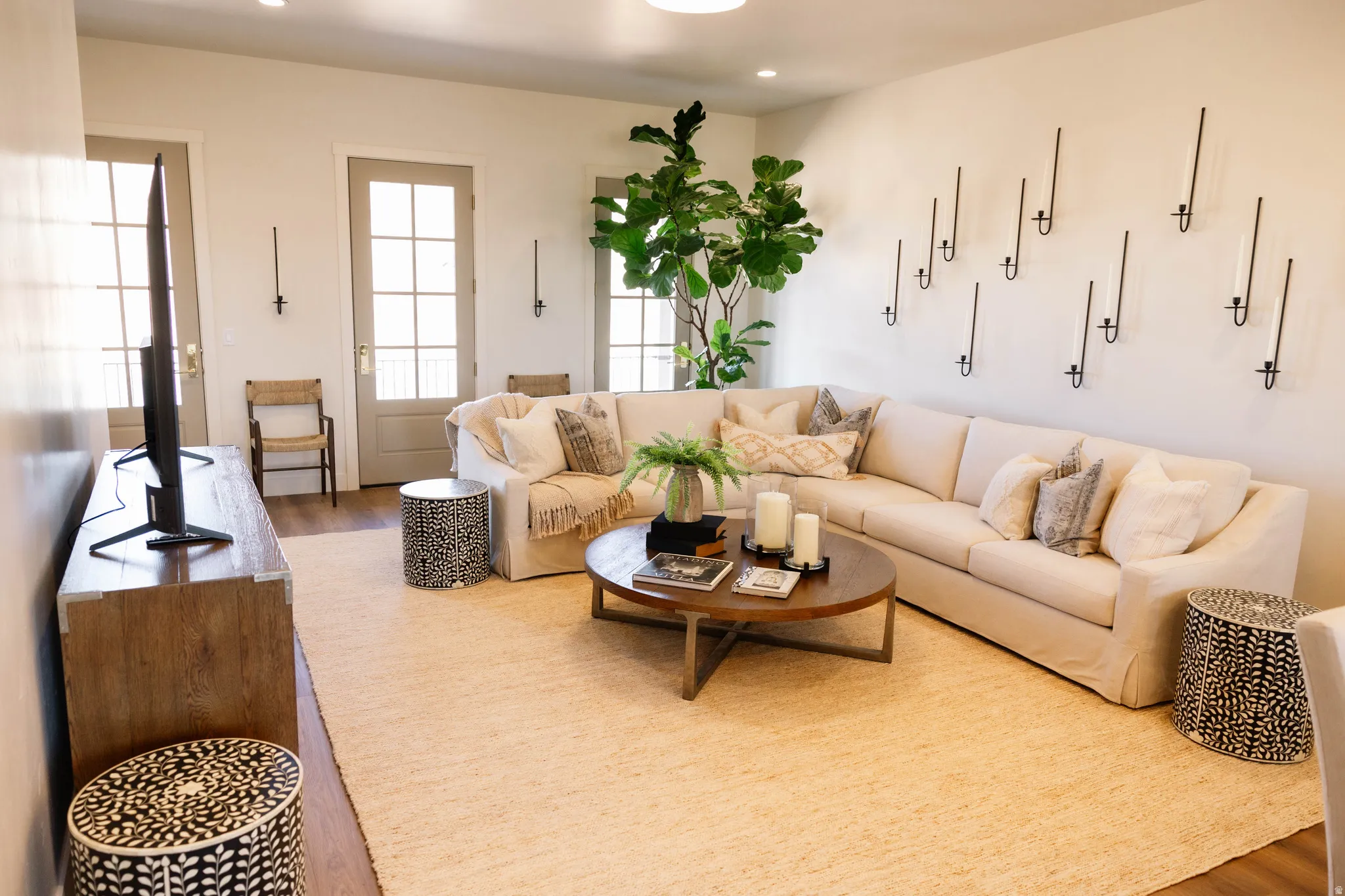 Living area featuring wood finished floors and recessed lighting