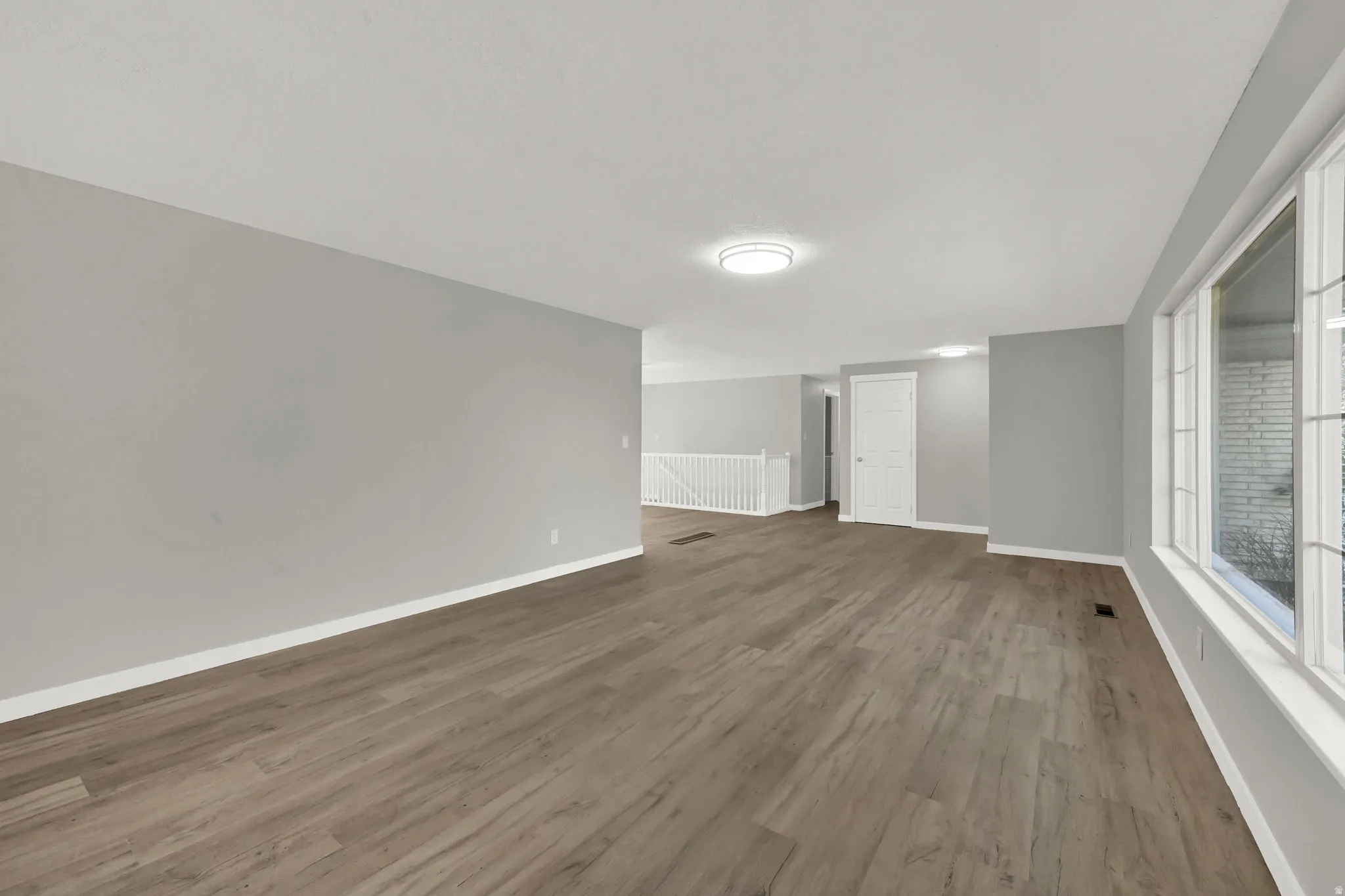 Empty room featuring light wood-style flooring
