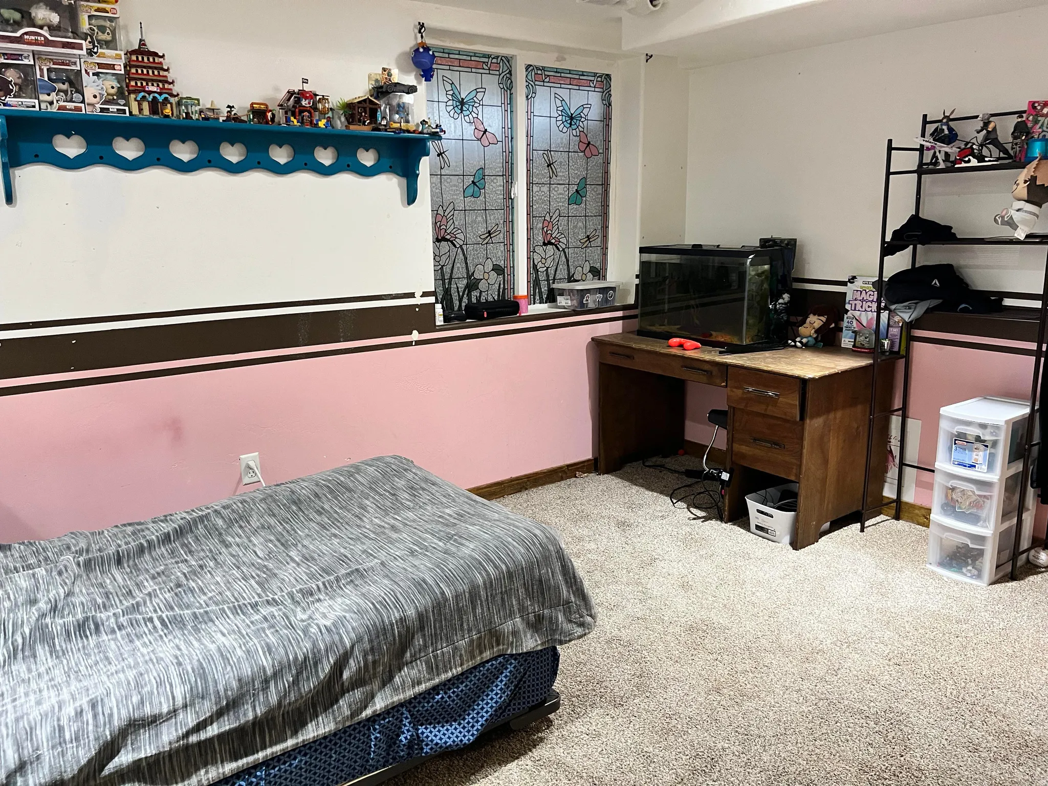 Bedroom featuring carpet and baseboards