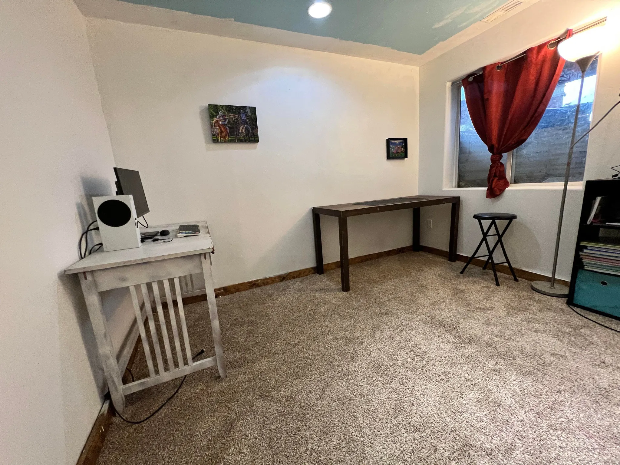 Office space featuring recessed lighting and light colored carpet